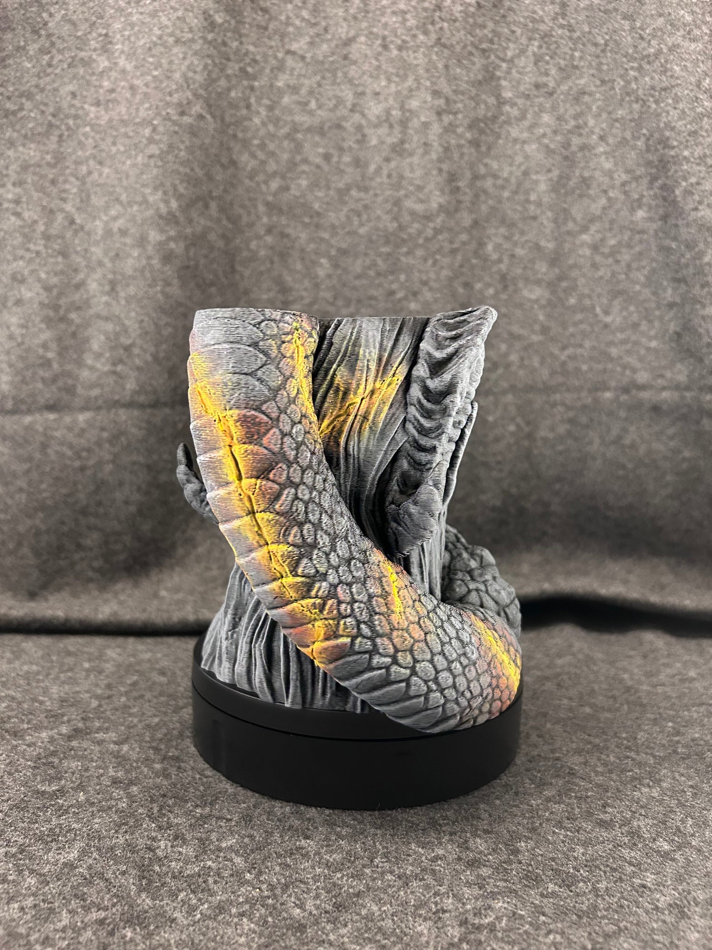 Side view of the Serpent Oracle showing the amber glow painted into the scales of the serpent.