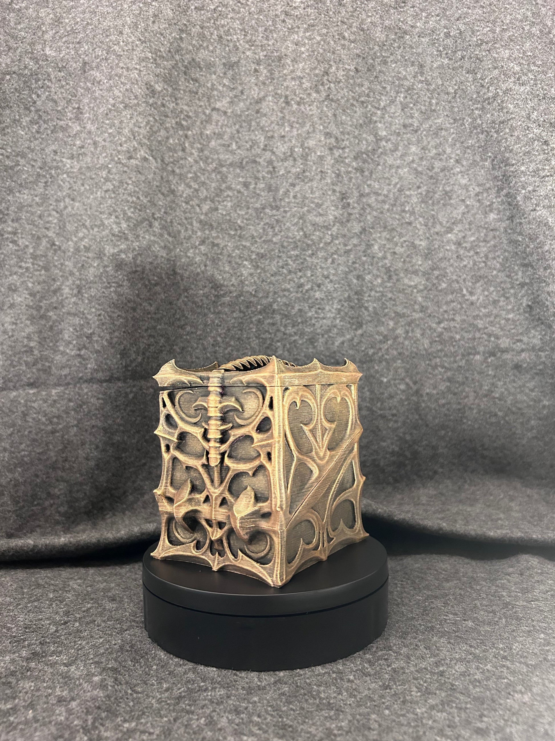 Close view of the bronze dry-brushing worked into the gothic arch cut-outs on the deck box.