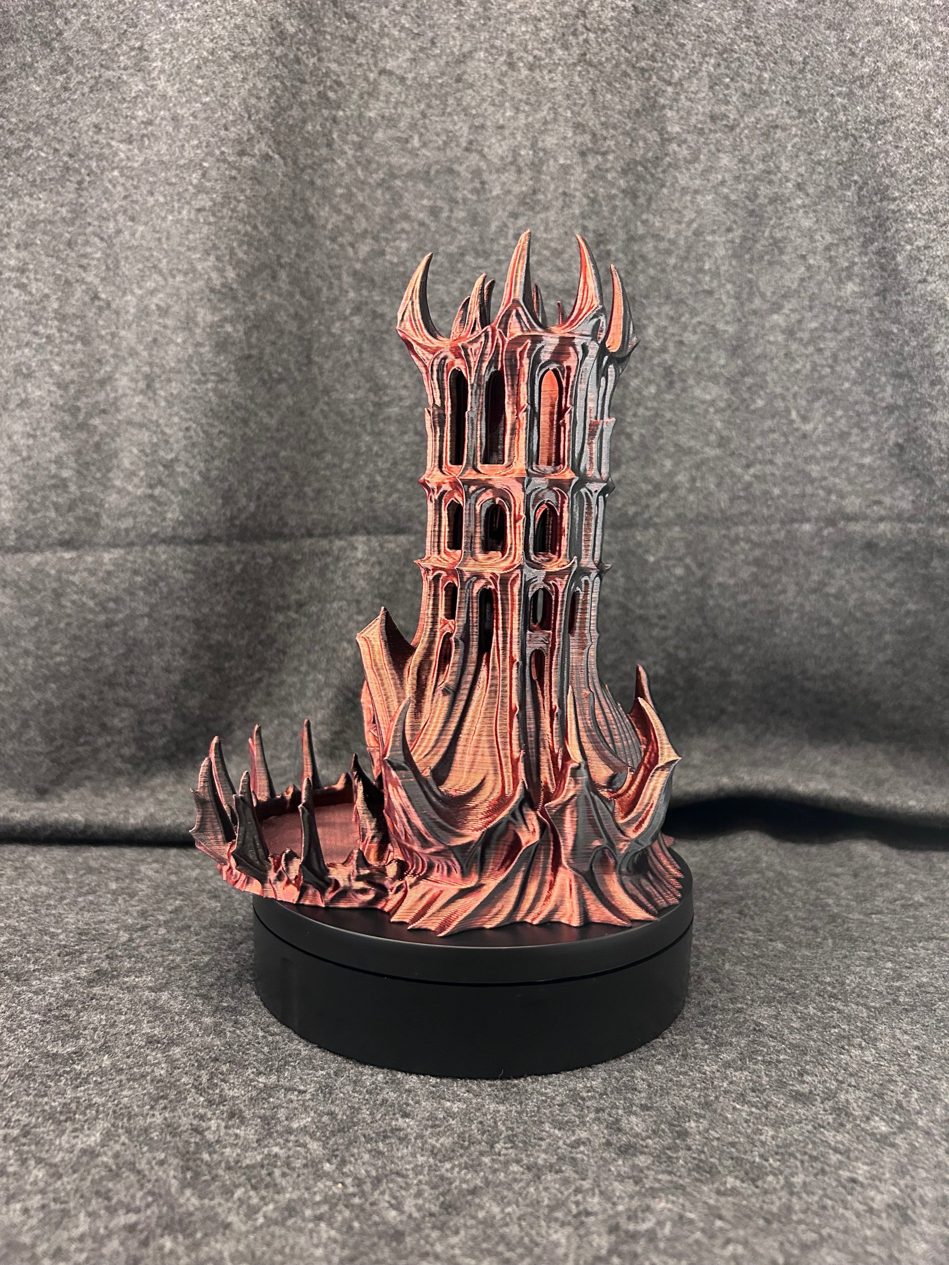 Hand-painted gothic dice tower with pierced arch windows and a crown of finials, finished in aged copper.