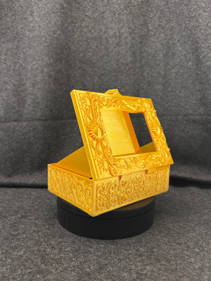 The Gilded Sun Codex closed, showing the scrollwork border and sun motifs.