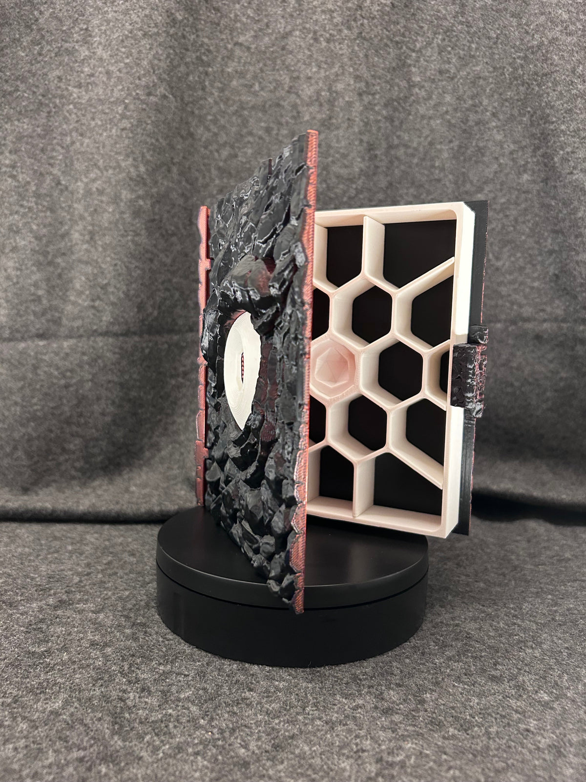 Hand-painted scaled dice case open, showing the fitted honeycomb tray that holds each die.
