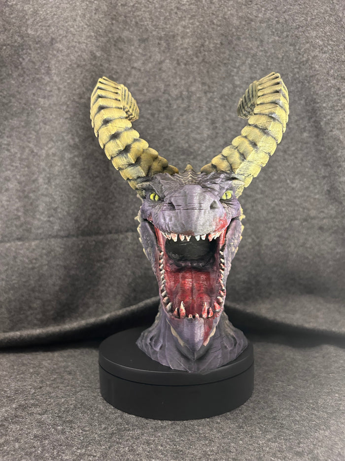 Front view of the Duskmaw dragon bust with jaws open, showing the teeth and red tongue.
