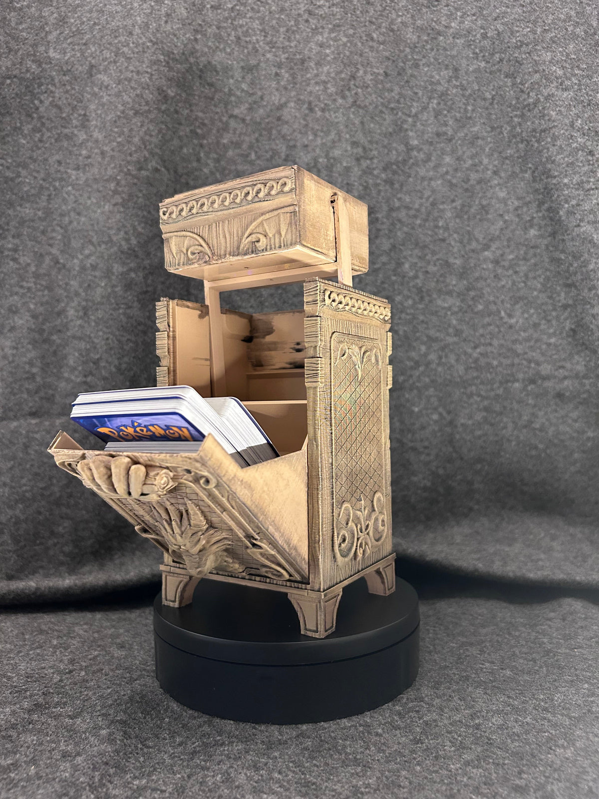 Hand-painted bone-coloured deck chest with the lid lifted off and a full deck of cards inside.