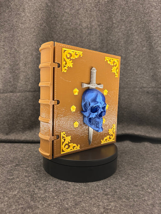 The Sworn Grimoire closed, showing the skull-and-sword emblem set into the cover.