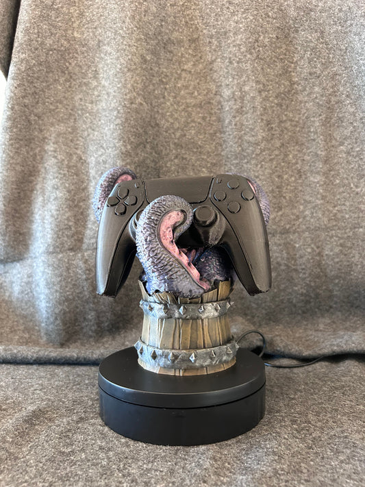 Hand-painted mimic tankard controller stand with tongues curled up to hold a controller.