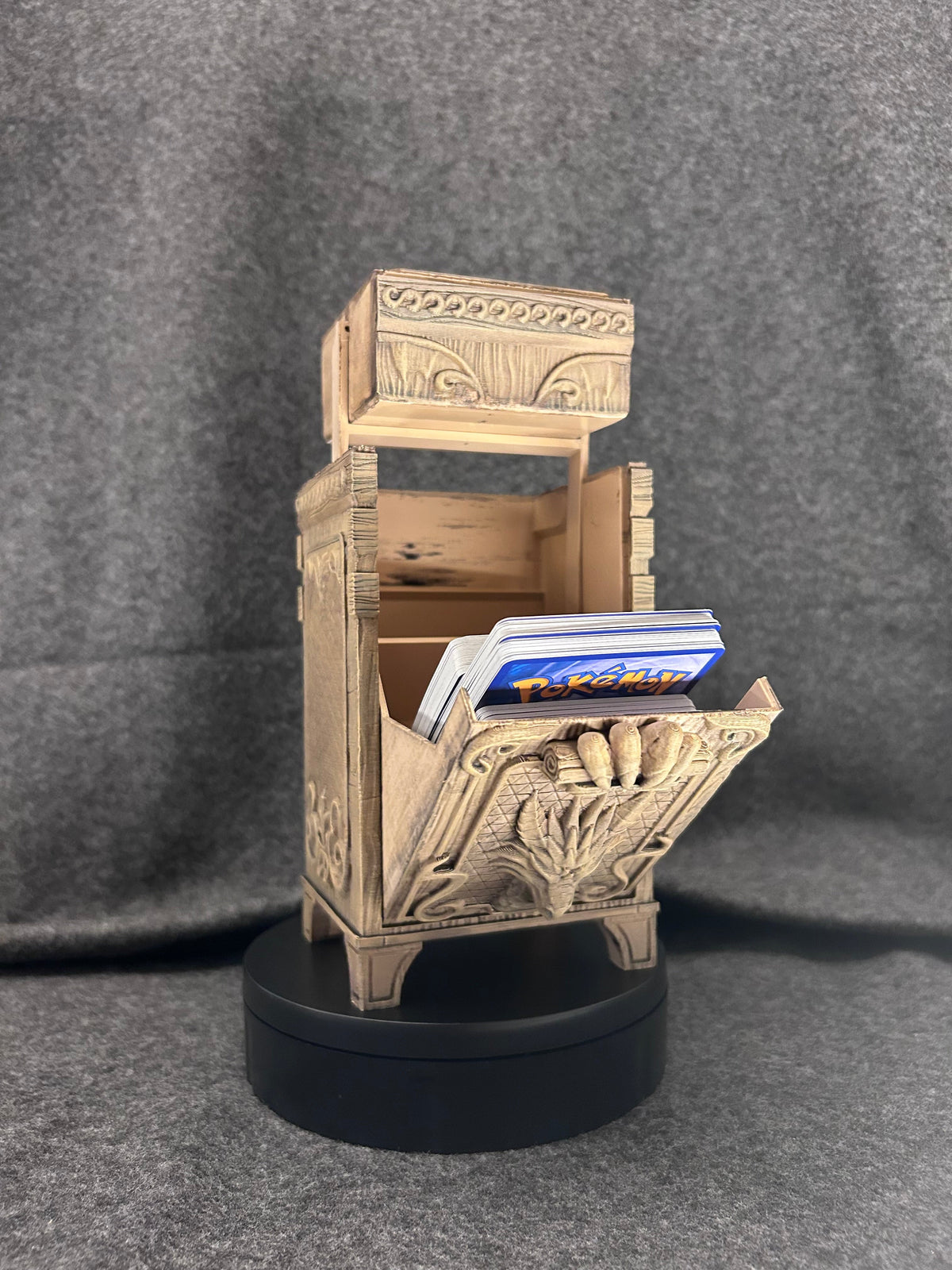 The Antiquarian deck chest closed, showing the carved scrollwork along every edge.