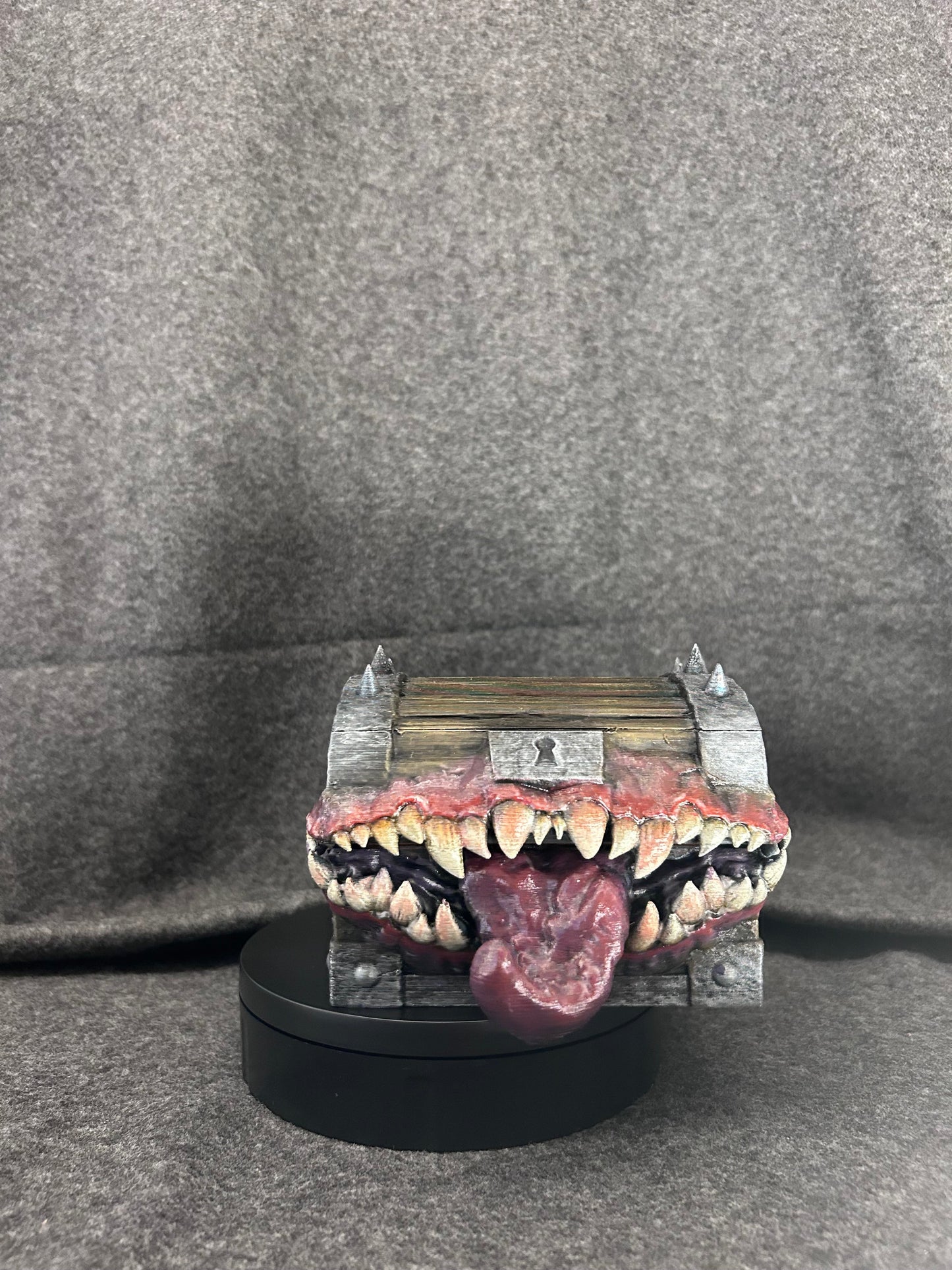 Close view of the painted fangs, gums and keyhole plate on the mimic chest.