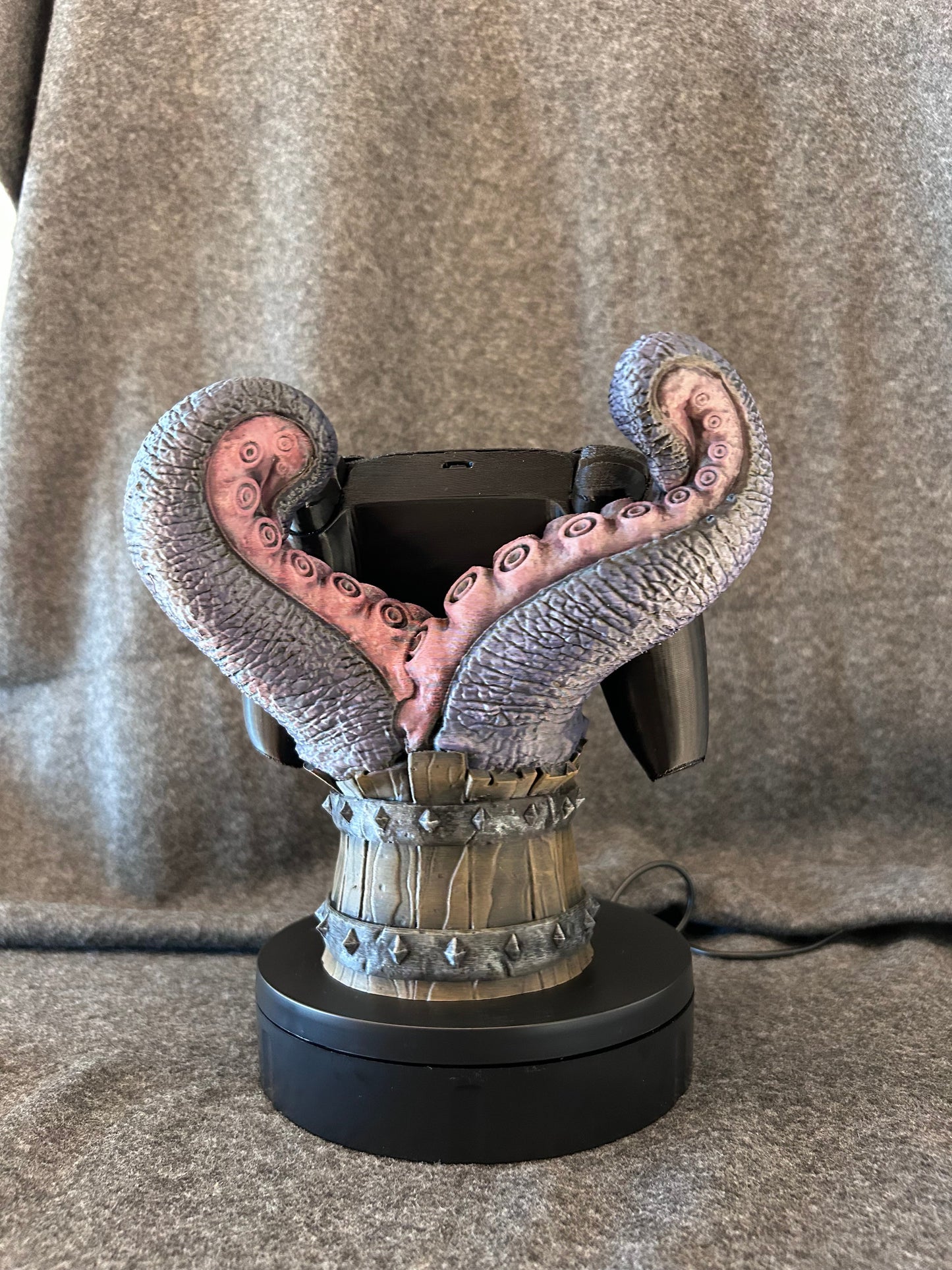 Side view of the mimic controller stand showing the iron-banded staves and open mouth.