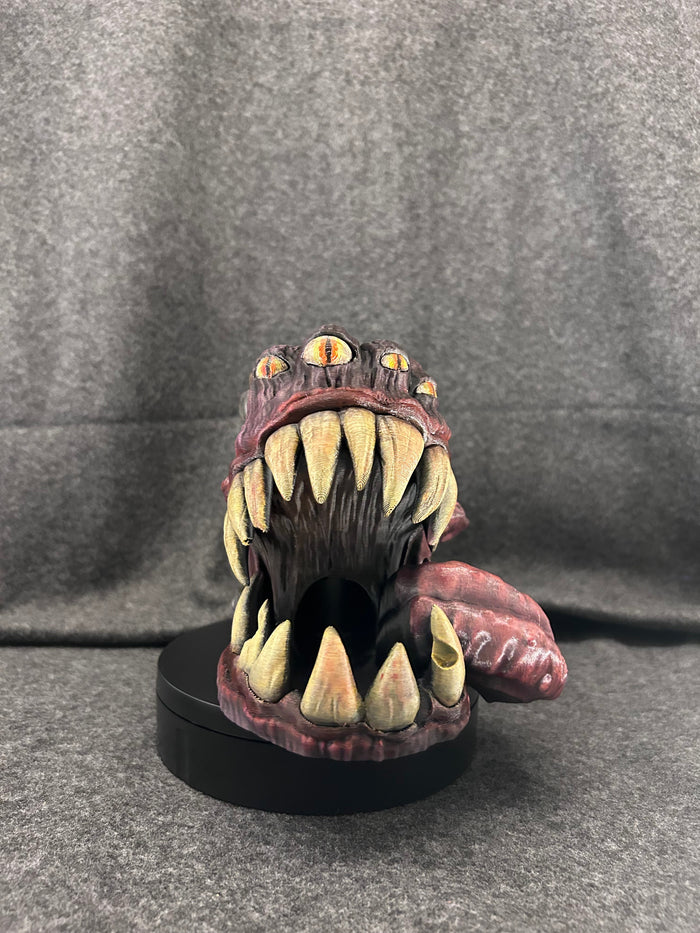 Hand-painted mimic tankard can holder, iron-banded staves with a fanged mouth and lolling tongue.