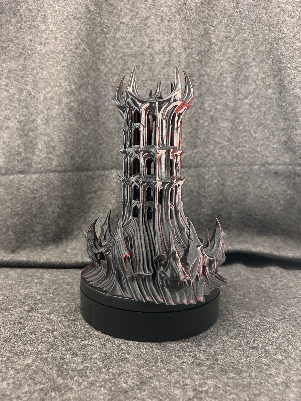 The same gothic dice tower in a darker black and bronze finish.