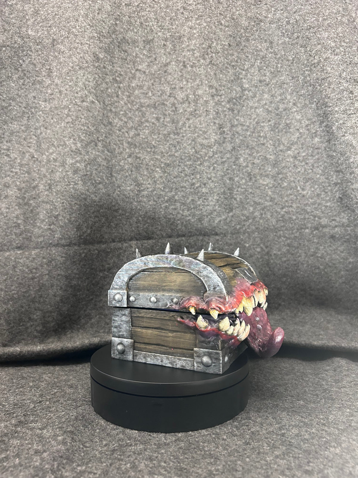 Side view of the Gnashwood mimic chest showing the iron banding and corner spikes.