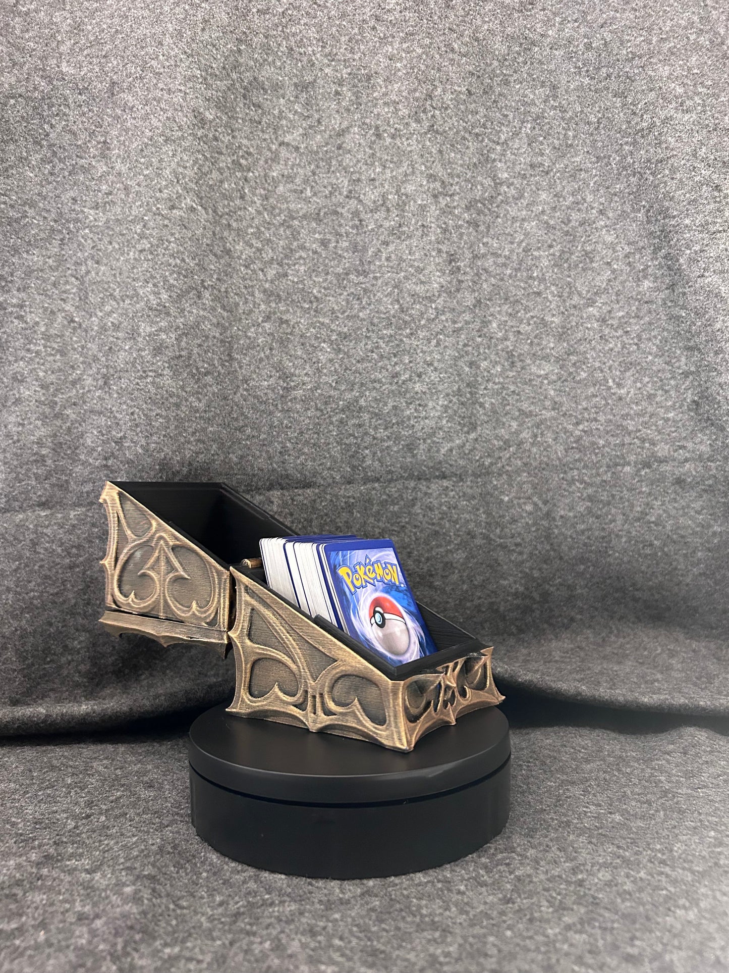 Hand-painted gothic deck box hinged open with a full stack of sleeved trading cards inside.