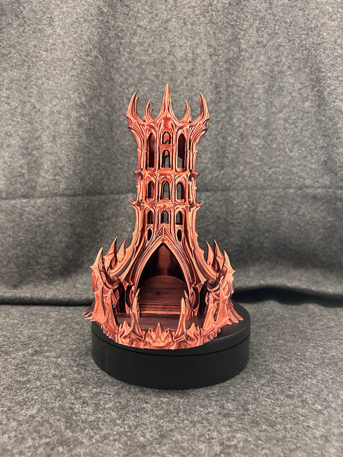 Side view of the Vespers dice tower showing the buttresses running down each corner.