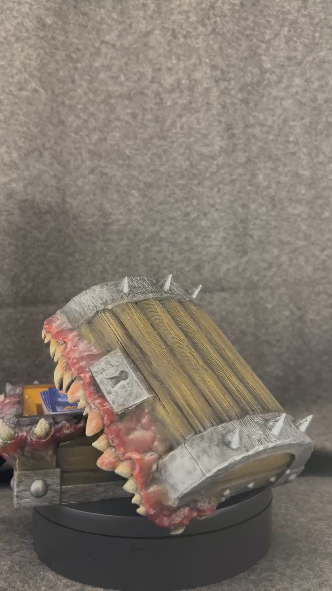 The Gnashwood mimic chest turning on a display stand, showing the fangs and lolling tongue.