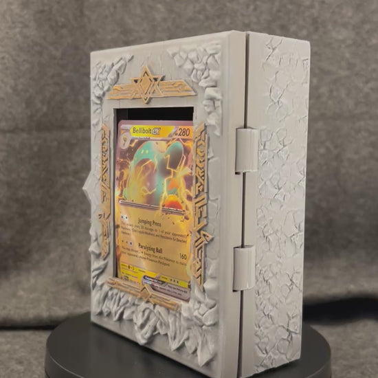 The Runestone Codex turning on a display stand, showing the carved rune band and gold-picked recesses.
